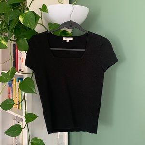 This knitted shirt was worn only once. It is in like new condition